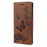 Peňaženkové kožené puzdro Butterflies na Xiaomi Redmi Note 10/10S - Hnedá
